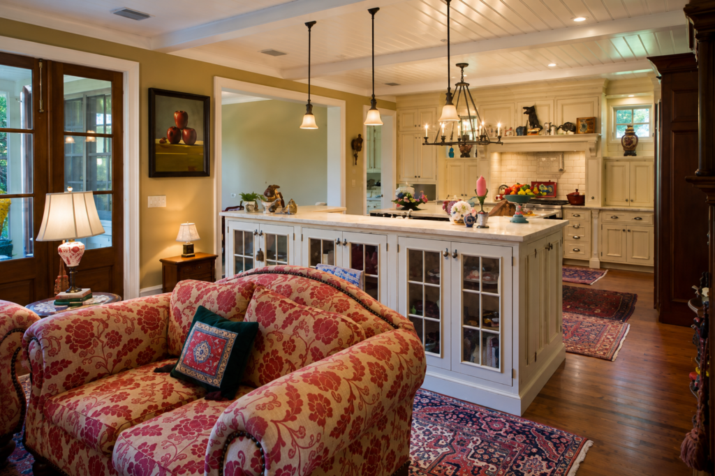Urban Life Low Country open kitchen and family room with beadboard ceiling and pendant lighting by Posada Custom Homes in Orlando, FL